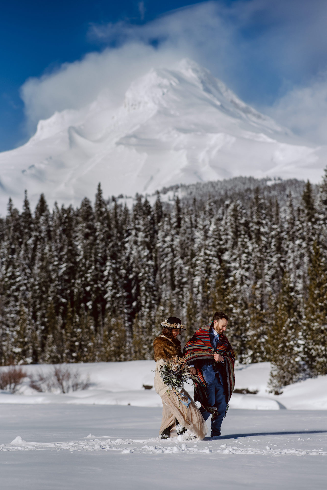 Play in the snow on a mountain on your elopement day